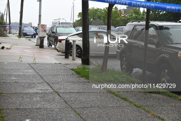 Evidence markers are being placed at the scene of the fatal shooting of a 28-year-old male in the Bronx, New York. A 28-year-old male victim...