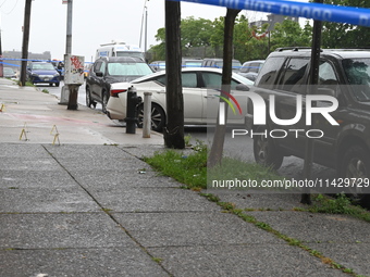 Evidence markers are being placed at the scene of the fatal shooting of a 28-year-old male in the Bronx, New York. A 28-year-old male victim...