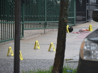 Evidence markers are being placed at the scene of the fatal shooting of a 28-year-old male in the Bronx, New York. A 28-year-old male victim...