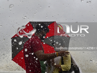 Visitors are reacting to sea waves at the Marine Drive promenade during high tide in Mumbai, India, on July 23, 2024. (