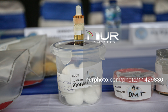 Indonesian National Narcotic Agency (BNN) officers are displaying evidence after a raid of a drug lab, during a press conference in Gianyar,...