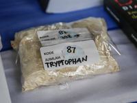 Indonesian National Narcotic Agency (BNN) officers are displaying evidence after a raid of a drug lab, during a press conference in Gianyar,...