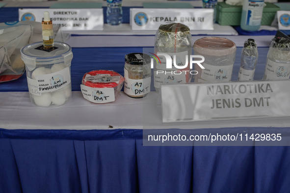 Indonesian National Narcotic Agency (BNN) officers are displaying evidence after a raid of a drug lab, during a press conference in Gianyar,...