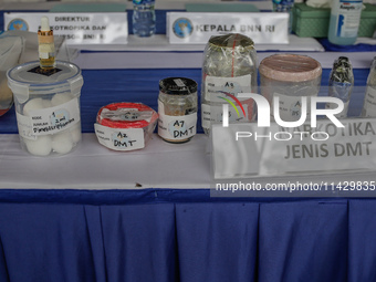 Indonesian National Narcotic Agency (BNN) officers are displaying evidence after a raid of a drug lab, during a press conference in Gianyar,...