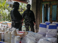 Indonesian National Narcotic Agency (BNN) officers are displaying evidence after a raid of a drug lab, during a press conference in Gianyar,...