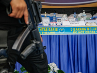 Indonesian National Narcotic Agency (BNN) officers are displaying evidence after a raid of a drug lab, during a press conference in Gianyar,...