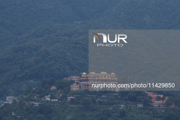 A Buddhist monastery is sitting on the hill slope of Kathmandu, Nepal, on July 23, 2024, after overnight rainfall which is bringing in clear...