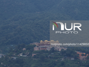 A Buddhist monastery is sitting on the hill slope of Kathmandu, Nepal, on July 23, 2024, after overnight rainfall which is bringing in clear...