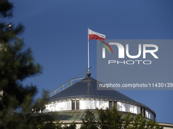 Poland's national flag is fluttering on top of the Polish parliament during a rally in favor of free and safe abortion in Warsaw, Poland, on...