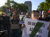 People are holding placards with Poland's Women's Strike thunder logo as they are taking part in a rally in favor of free and safe abortion...