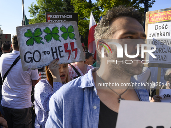 Demonstrators are shouting slogans and holding signs as they are taking part in a rally in favour of free and safe abortion in Warsaw, Polan...