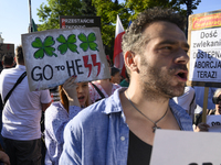 Demonstrators are shouting slogans and holding signs as they are taking part in a rally in favour of free and safe abortion in Warsaw, Polan...