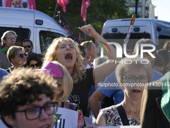 Demonstrators are shouting slogans as they are taking part in a rally in favor of free and safe abortion in Warsaw, Poland, on July 23, 2024...