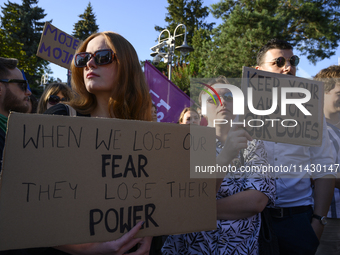 Demonstrators are holding signs as they are taking part in a rally in favor of free and safe abortion in Warsaw, Poland, on July 23, 2024. H...