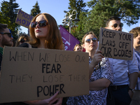 Demonstrators are holding signs as they are taking part in a rally in favor of free and safe abortion in Warsaw, Poland, on July 23, 2024. H...