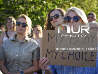 Women are holding a sign as they are taking part in a rally in favor of free and safe abortion in Warsaw, Poland, on July 23, 2024. Hundreds...