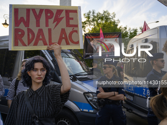 A woman is holding a sign reading ''Fuck off'' as pro-life activists are staging a counter-demonstration during a rally in favor of free and...