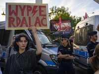 A woman is holding a sign reading ''Fuck off'' as pro-life activists are staging a counter-demonstration during a rally in favor of free and...