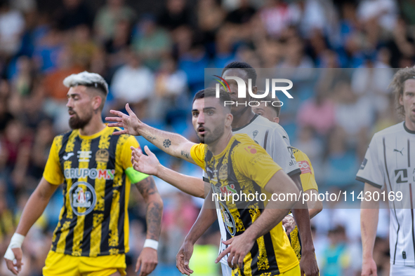 Players are in action during the second phase of the UEFA Champions League Qualification 2024-2025 match between UD Santa Coloma and FC Midt...