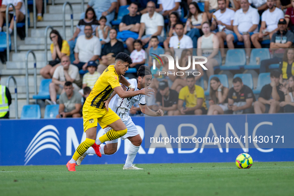 Players are in action during the second phase of the UEFA Champions League Qualification 2024-2025 match between UD Santa Coloma and FC Midt...