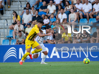 Players are in action during the second phase of the UEFA Champions League Qualification 2024-2025 match between UD Santa Coloma and FC Midt...