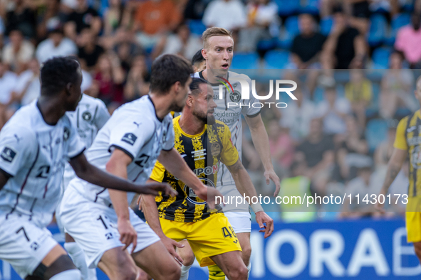 Players are in action during the second phase of the UEFA Champions League Qualification 2024-2025 match between UD Santa Coloma and FC Midt...