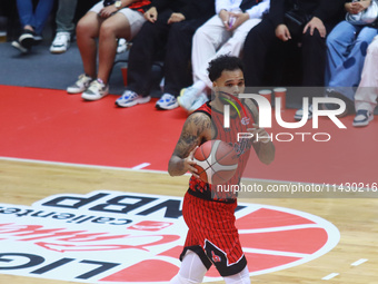 Avry Holmes #12 of Diablos Rojos is handling the ball during the National Professional Basketball League (LNBP) game between Diablos Rojos a...