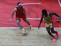 Mario Kegler #4 of Santos is driving the ball against Joseph Avila of Diablos Rojos during the National Professional Basketball League (LNBP...