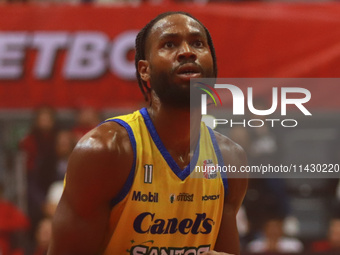 Johnny Hughes III #11 of Santos is preparing to shoot a free throw during the National Professional Basketball League (LNBP) game between Di...