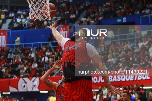 Joshua Ibarra #44 of Diablos Rojos is rebounding during the National Professional Basketball League (LNBP) game between Diablos Rojos and Sa...