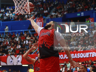 Joshua Ibarra #44 of Diablos Rojos is rebounding during the National Professional Basketball League (LNBP) game between Diablos Rojos and Sa...