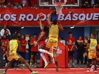 Avry Holmes #12 of Diablos Rojos is driving to the basket during the National Professional Basketball League (LNBP) game between Diablos Roj...