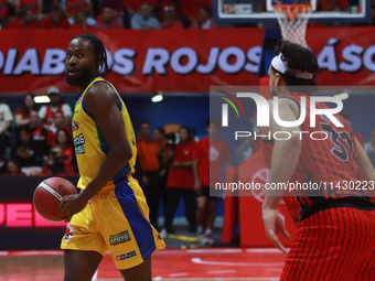 Johnny Hughes III #11 of Santos is driving to the basket during the National Professional Basketball League (LNBP) game between Diablos Rojo...