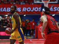 Johnny Hughes III #11 of Santos is driving to the basket during the National Professional Basketball League (LNBP) game between Diablos Rojo...