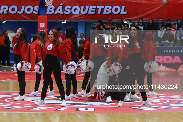 Diablos Rojos Cheerleaders are performing during the National Professional Basketball League (LNBP) game between Diablos Rojos and Santos de...