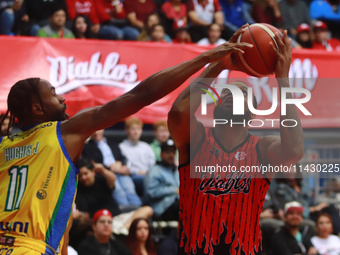 Maique Tavares #35 of the Diablos Rojos is shooting the ball against Johnny Hughes III #1 of Santos during the National Professional Basketb...