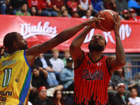 Maique Tavares #35 of the Diablos Rojos is shooting the ball against Johnny Hughes III #1 of Santos during the National Professional Basketb...