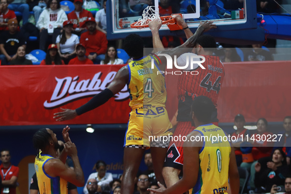 Joshua Ibarra #44 of Diablos Rojos is slam dunking during the National Professional Basketball League (LNBP) game between Diablos Rojos and...