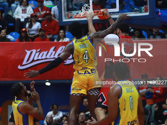 Joshua Ibarra #44 of Diablos Rojos is slam dunking during the National Professional Basketball League (LNBP) game between Diablos Rojos and...