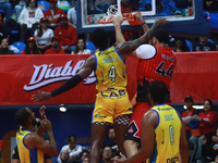 Joshua Ibarra #44 of Diablos Rojos is slam dunking during the National Professional Basketball League (LNBP) game between Diablos Rojos and...