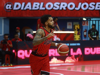 Avry Holmes #12 of Diablos Rojos is handling the ball during the National Professional Basketball League (LNBP) game between Diablos Rojos a...