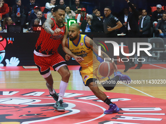 Jader Fernandez #2 of Santos is driving to the basket during the National Professional Basketball League (LNBP) game between Diablos Rojos a...