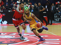 Jader Fernandez #2 of Santos is driving to the basket during the National Professional Basketball League (LNBP) game between Diablos Rojos a...