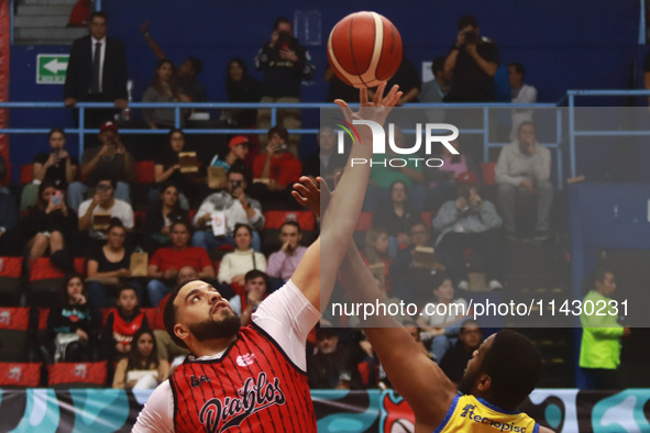 Joshua Ibarra #44 of Diablos Rojos is winning the ball in the tip-off during the National Professional Basketball League (LNBP) game between...