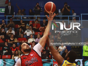 Joshua Ibarra #44 of Diablos Rojos is winning the ball in the tip-off during the National Professional Basketball League (LNBP) game between...