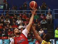 Joshua Ibarra #44 of Diablos Rojos is winning the ball in the tip-off during the National Professional Basketball League (LNBP) game between...