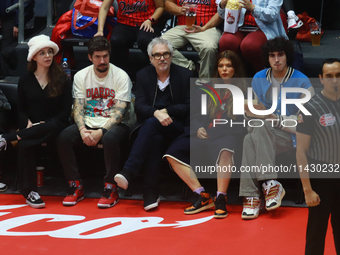 Mexican director Alfonso Cuaron is being seen during the game of the National Professional Basketball League (LNBP) between Diablos Rojos an...