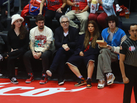 Mexican director Alfonso Cuaron is being seen during the game of the National Professional Basketball League (LNBP) between Diablos Rojos an...