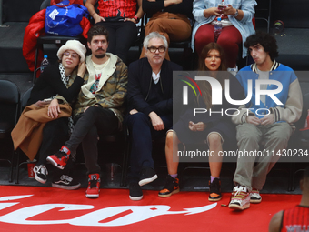 Mexican director Alfonso Cuaron is being seen during the game of the National Professional Basketball League (LNBP) between Diablos Rojos an...