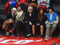 Mexican director Alfonso Cuaron is being seen during the game of the National Professional Basketball League (LNBP) between Diablos Rojos an...